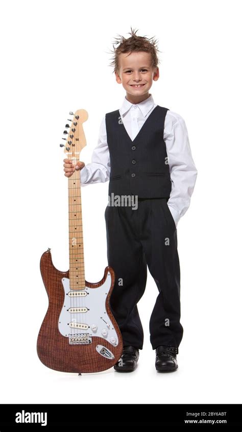 Boy holding a guitar Stock Photo - Alamy