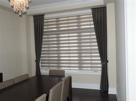 Our pleated-style combi roller blinds in grey goes well with reverse pleat side panel dark taupe ...