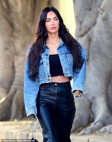 Megan Fox displays a hint of her abs in a crop top as she debuts her new tresses after salon ...