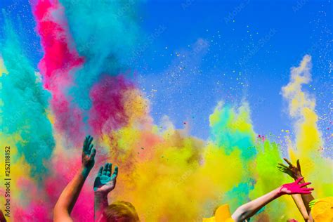 crowd throws colored powder at holi festival Stock Photo | Adobe Stock