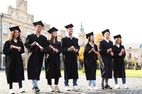 Happy Students with Diplomas. Graduation Ceremony Stock Photo - Image of hats, academic: 161910132