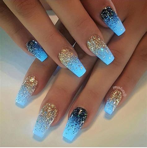 Blue glow in the dark coffin nails manicure with gold glitter and blue ...