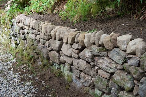 Building A Stone Retaining Wall Without Mortar! - The Homesteading Hub