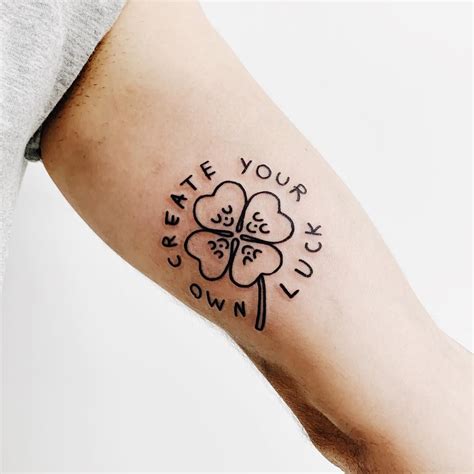 Minimalist shamrock and words ‘Create your own luck’ tattoo inked on ...