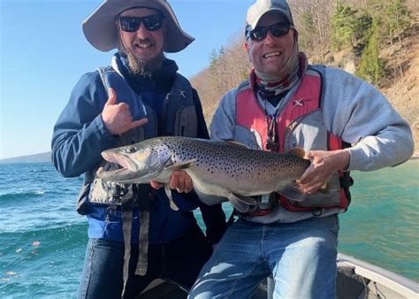 NYC tattoo artist lands monster mystery fish on Skaneateles Lake: Is it a trout or a salmon ...