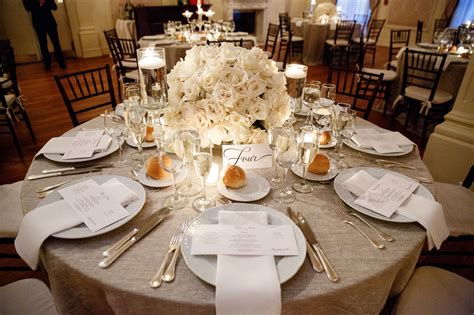 Champagne Table Linens With White Flowers and Candles
