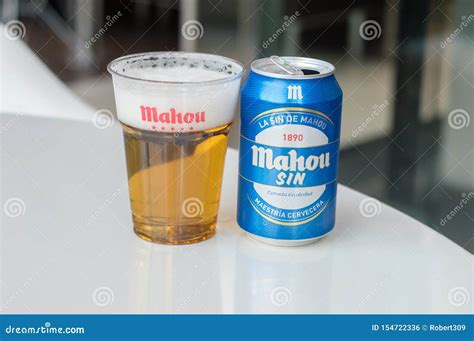 Mahou Beer in a Plastic Cup with Mahou Logo and Can of Mahou Sin Beer ...