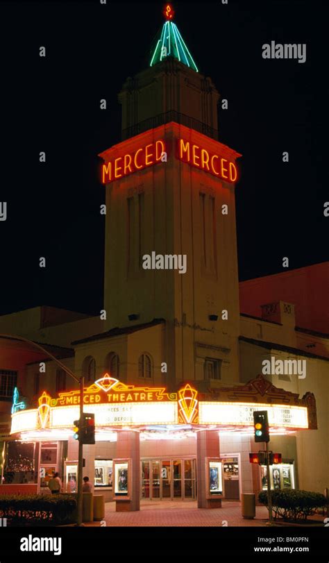 Facade of a theater lit up at night, Merced Theater, Merced, California ...