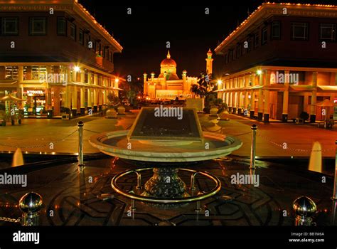 BRUNEI, Bandar Seri Begawan. Night view of a fountain in the illuminated city center of Bandar ...