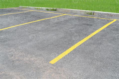 yellow lines parking on asphalt background 19878155 Stock Photo at Vecteezy