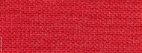 Texture of bright red color background from textile material with wicker pattern. Vintage ruby ...