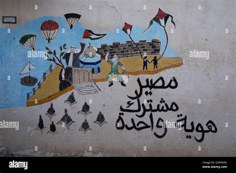 A graffiti depicting Israel Palestine conflict painted in Al Bustan ...