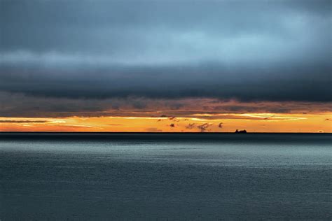 Stormy weather at dusk - sunset on the Bering sea, Alaska. Photograph ...