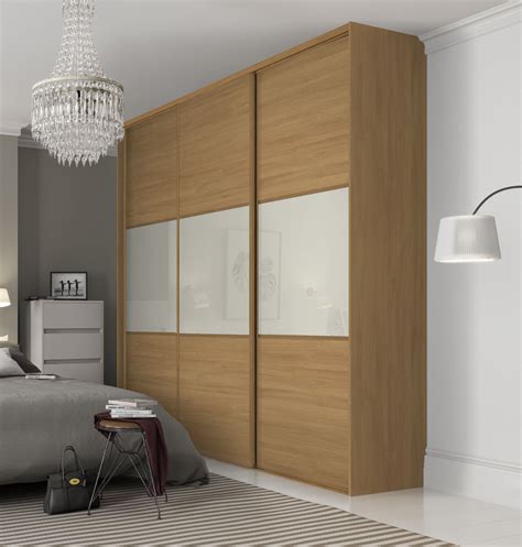 Beautiful, classic three panel sliding wardrobe doors in Oak and Soft White finish with Oak fram ...