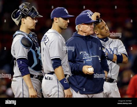 Tampa Bay Rays manager Joe Maddon waits with infielders for a relief ...