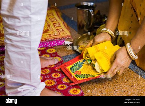 Varan or boron ritual being performed during hindu marriage or puja by traditional Bengali woman ...