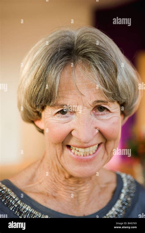 old woman smiling at viewer Stock Photo - Alamy