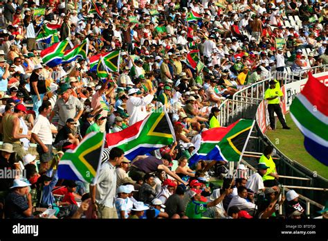 Large crowd of spectators cheering and waving South African flags Stock Photo: 32266808 - Alamy