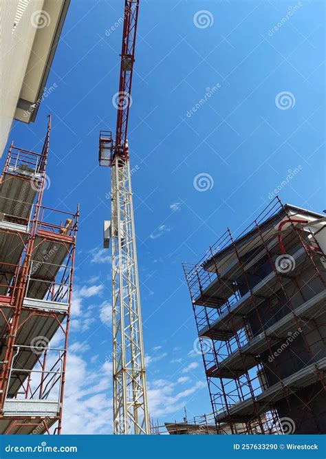 Vertical Shot of a Crane at a Construction Site Stock Photo - Image of ...