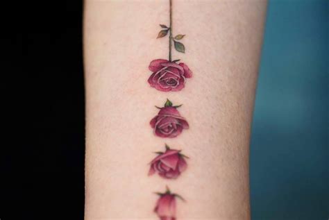 Details more than 52 rose blooming tattoo latest - in.cdgdbentre