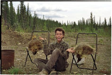 This photograph was taken of Chris McCandless in Alaska with food that he found/ hunted ...