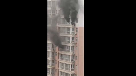 Video captures China residents clinging to ledge as fire rages in high-rise apartment building ...