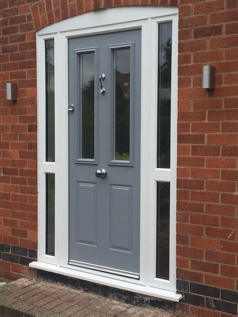 Moondust grey composite door in a white upvc frame. Installed by Windseal Double Glazing based ...