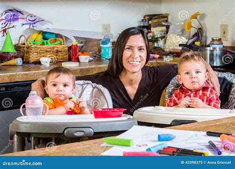 Mother Smiles with Babies stock image. Image of chaotic - 43398375