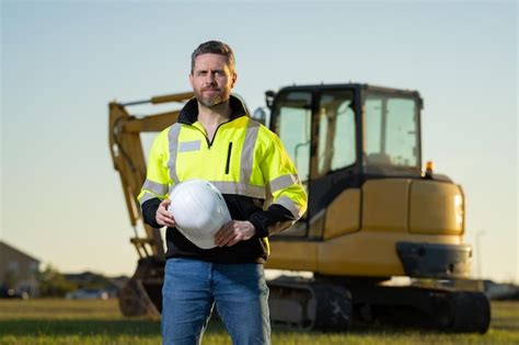 Premium Photo | Worker with bulldozer on the building construction