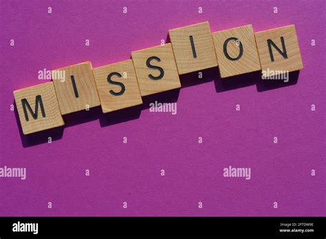 Mission, word in wooden alphabet letters isolated on purple background with copy space Stock ...