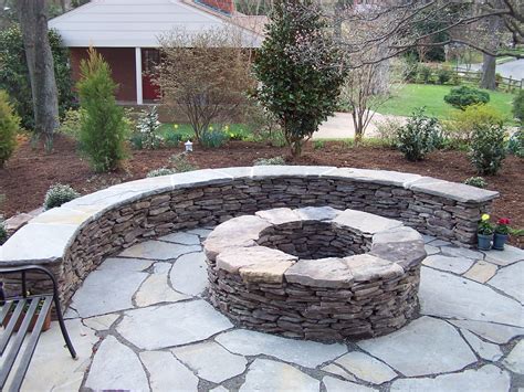 half wall, also note ground rocks could match path | Outdoor fire pit designs, Garden fire pit ...