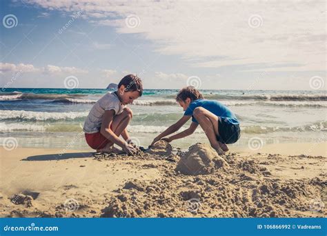 Two Kids Playing On Sand Beach Stock Image Colourbox ...