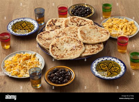 Traditional Moroccan breakfast with pancakes,eggs,olives,olive oil and mint tea Stock Photo - Alamy