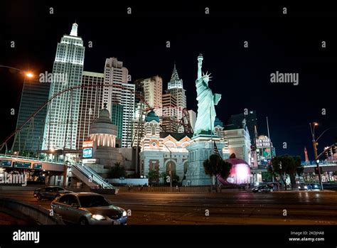 Cars on road by Replica of Statue Of Liberty in New York, New York ...