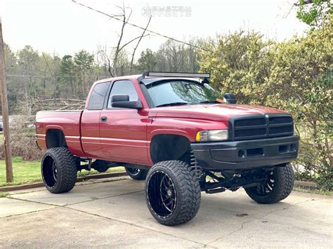 1997 Dodge Ram 1500 with 24x14 -76 TIS 544BM and 325/50R24 AMP Mud Terrain Attack Mt A and ...