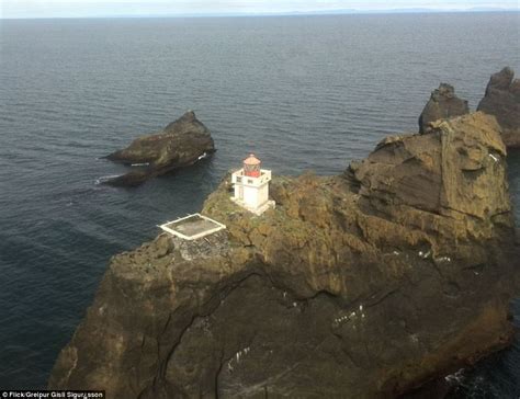 Would YOU change the bulb here? The isolated lighthouse perched on a ...