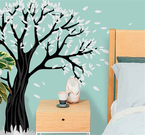 Modern black and white tree with flying leaves wall sticker - TenStickers