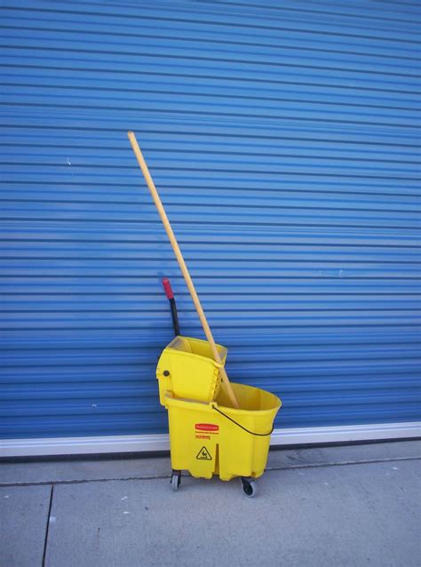 Brucker Brothers: Rubbermaid mop bucket and mop - SOLD