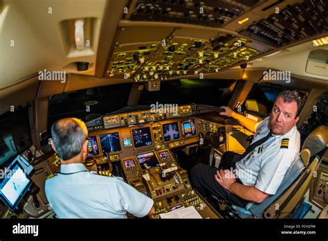 Pilots In The Cockpit Prepare The Delta Airlines Boeing 777 200lr For | Free Download Nude Photo ...