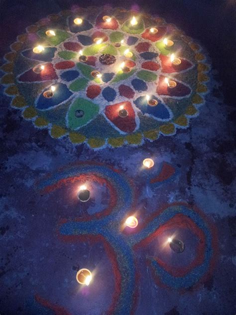 Rangoli and diyas outside - Stabroek News