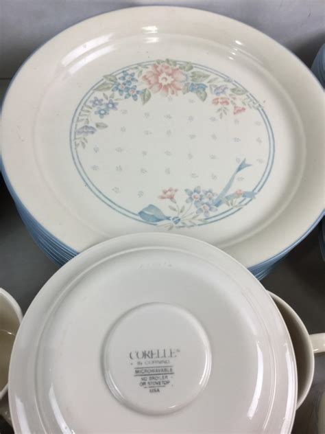 Lot - (56) Corelle Corningware Symphony Pattern Dishes