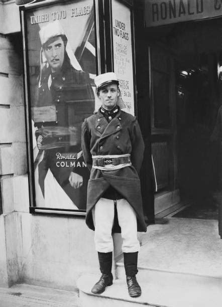 French Legionnaire In Front Of Poster Of Under Two Flags Film In London On 1938 Pictures | Getty ...