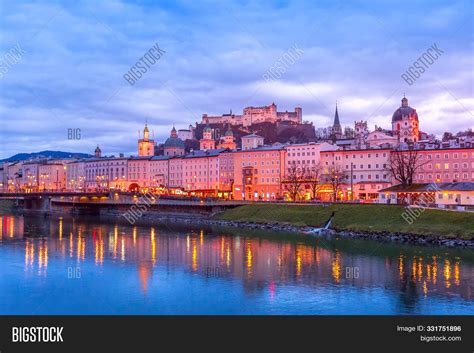 Salzburg, Austria Evening Twilight View With Illuminated Cathedral And Hohensalzburg Festung ...