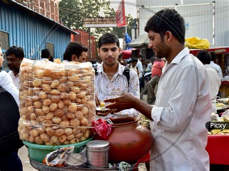 Image of Indian Street Food Panipuri Or Golgappae Vendor Serving At a Road Side Street Food ...