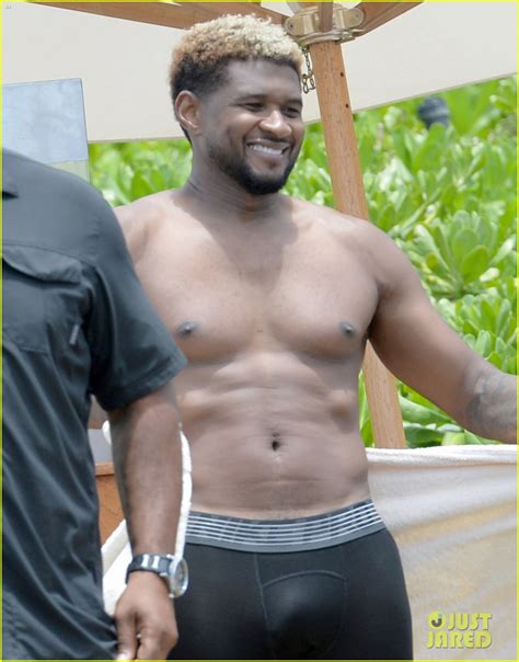 Usher Stays Clothed While Paddle Boarding, Goes Shirtless on the Beach ...