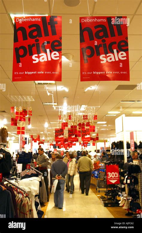 Sales posters in a department store in England UK Stock Photo - Alamy