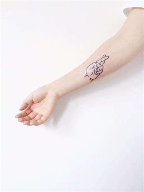 Minimalist Outline Hand Tattoo at Sang Bleu Studio, London