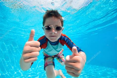 Boy swimming underwater — Stock Photo © shalamov #39984463