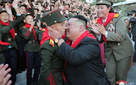 One for the album! The moment a special child got a kiss from Kim Jong-un