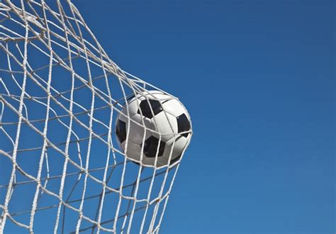 Premium Photo | Soccer ball in the net of a goal. soccer concept